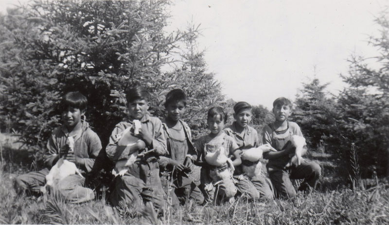 "Beginners" and grade ones with ducks, Round Lake Indian Residential School.