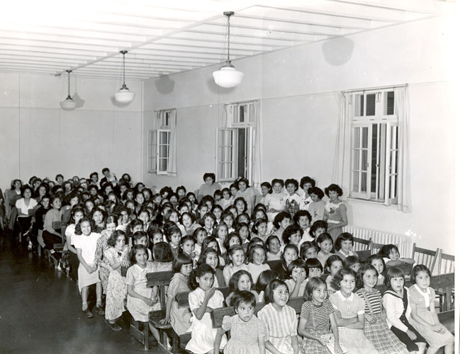 Girls in the Assembly Hall of the Alberni Indian Residential School, circa 1960.