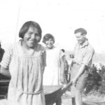 Students and Mr. Bailey, bringing coal from the beach, Ahousaht Indian Residential School
