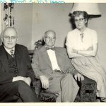 Dr. George Dorey, Mr. Lachlan McLean and Mrs. McLean seated posed for a photo indoors.