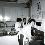 Students cleaning up in the kitchen, Portage la Prairie Indian Residential School.