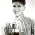 Portrait of youth holding a trophy