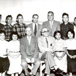 A group of students with government and school officials.