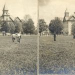 Children playing on a grassy space in the foreground with the Mount Elgin Residential School building and trees seen in the background.