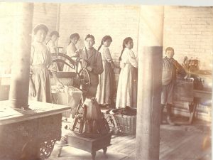 Girls and boys doing laundry, Mount Elgin Institute.