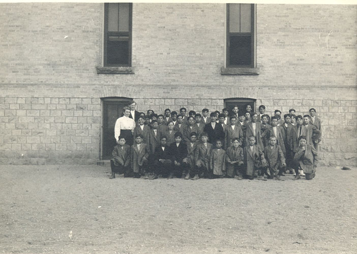 [Children with some of the staff in front of Mount Elgin Industrial