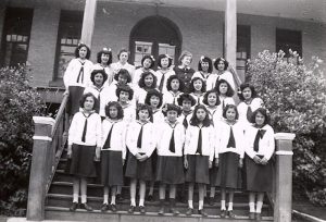 The principal's wife with the Canadian Girls in Training (CGIT) group.
