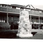 Large stone cairn in front of File Hills Residential School.