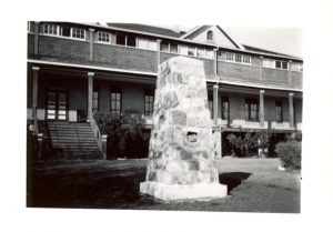 Large stone cairn in front of File Hills Residential School.