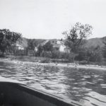 View of the Round Lake Residential School residence and school from the lake with the Qu'Appelle hills in the background