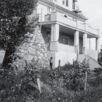 View of the residence and the cairn, Round Lake Indian Residential School.