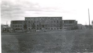Exterior view of Norway House Residential School building in the distance.