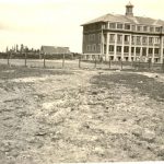 Exterior view of Norway House Residential School in distance.