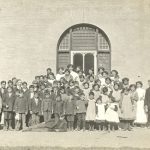 Scholars and staff outside school.