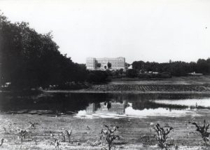Brandon Residential School with surrounding lake, fields and trees.