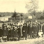 Staff and students of Crosby Girls' Home dressed in hats and overcoats, Port Simpson.