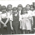 Eight children on veranda of Port Simpson Residential School