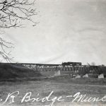 View of bridge in the distance, caption reads 