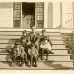 The teacher and some boys on the steps, Elizabeth Long Memorial Home, Kitamaat.