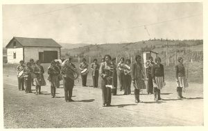 School band standing on road in formation