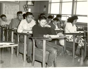 Boys and girls at the blackboard, Morley Indian Residential School, circa 1950.