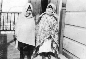 Two students standing outside Crosby Girls' Home.