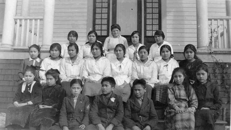 Students sitting on steps outside Crosby Girls' Home.