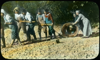 Children pulling rope while staff steer leveler to level the ground, image hand coloured