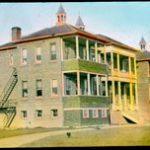 Norway House Residential School Building seen from the front corner. Front and side of building can be seen.