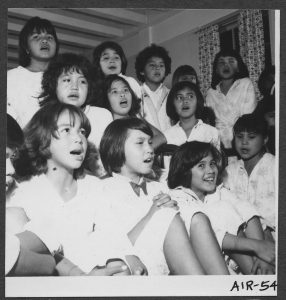 Girls having sing-song before bedtime