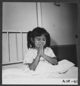 Little girl saying prayers