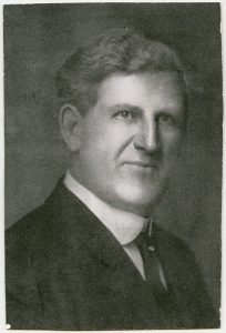 Portrait of Rev. Samuel Roberts McVitty in a suit and tie.