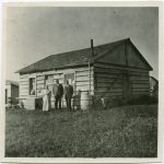 Rev. and wife Rev. and Mrs. Egerton Ryerson Steinhauer with the Superintendent of Indian Missions in front of the old school house, Morley, Alta. house