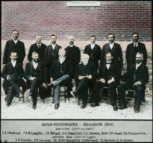 Thirteen missionaries, caption reads 