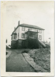 Port Simpson Residential School building, three-storeys with a large veranda entrance, driveway leading up to building