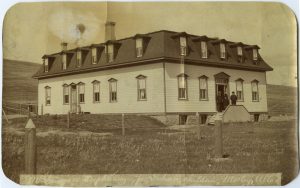 McDougall Orphanage and Training School building at centre with landscape behind the building.